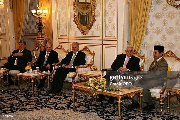 In this handout image supplied by the Palestinian Press Office , Palestinian President Mahmoud Abbas meets with Malaysian King Mizan Zainal Abidin...
