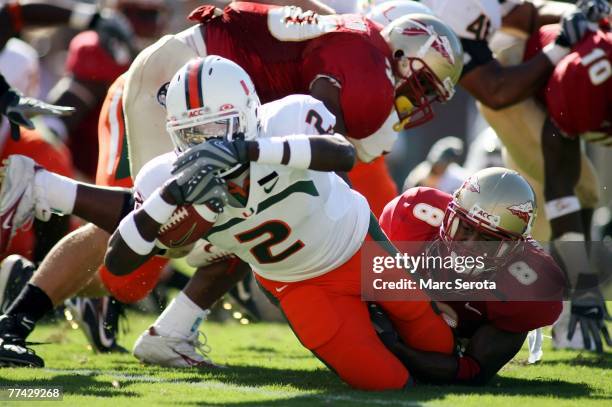 Running back Graig Cooper of the University of Miami Hurricanes scores a touchdown against the Florida State Seminoles at Bobby Bowden Field at Doak...