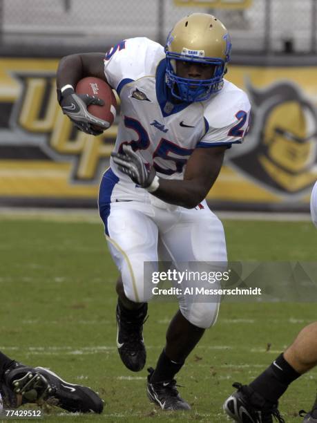 Running back Tarrion Adams of the Tulsa Golden Hurricane rushes upfield against the University of Central Florida at Bright House Stadium on October...