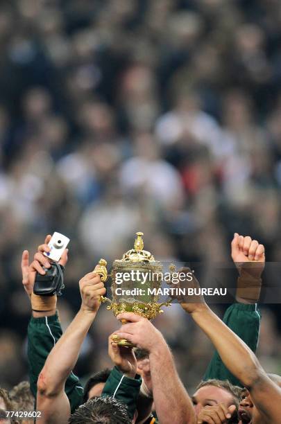 South Africa's players hold the William Webb Ellis trophy after the rugby union World Cup final match England vs. South Africa, 20 October 2007 at...