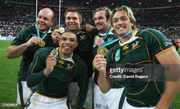 Os du Randt, Bryan Habana, John Smit, Jannie du Plessis and Percy Montgomery of South Africa pose with their winners medals after their team's...