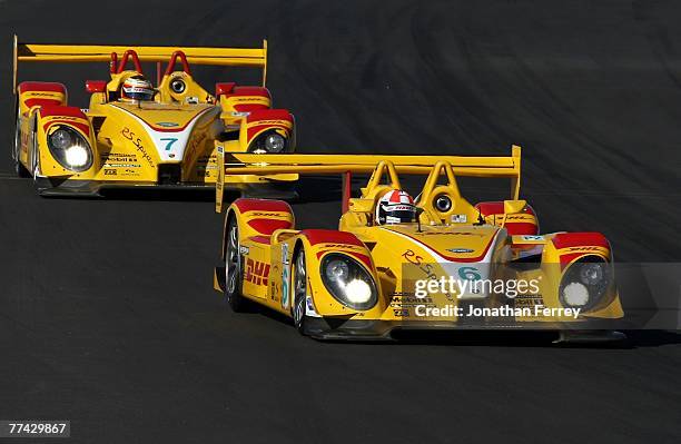 Sascha Maassen drives the Penske Racing DHL Porsche RS Spyder ahead of teammate Timo Bernhard in his Penske Racing DHL Porsche RS Spyder during...