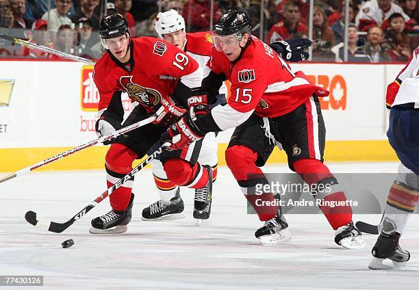 Jason Spezza and Dany Heatley of the Ottawa Senators carry the puck into the offensive zone on a power play against the Florida Panthers at...