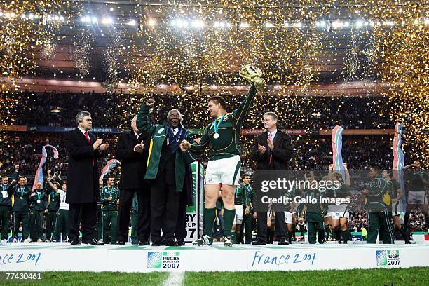 John Smit of South Africa holds the trophy with South African President Thabo Mbeki at the end IRB 2007 Rugby World Cup final match between South...