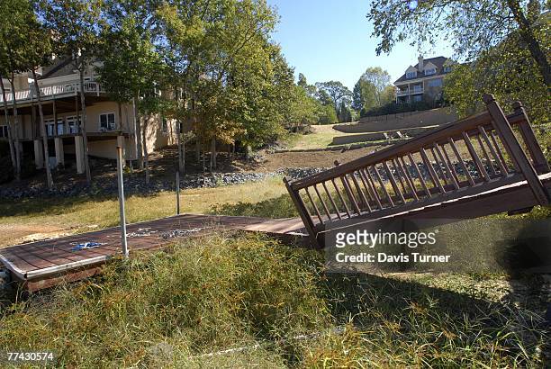 Grass grows around a dock in a cove that would normally be filled with lake water in the Riverpointe neighborhood of Lake Wylie October 20, 2007...