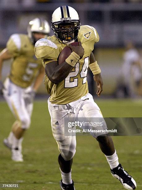 Running back Kevin Smith of the University of Central Florida Golden Knights rushes upfield against the Tulsa Golden Hurricane at Bright House...