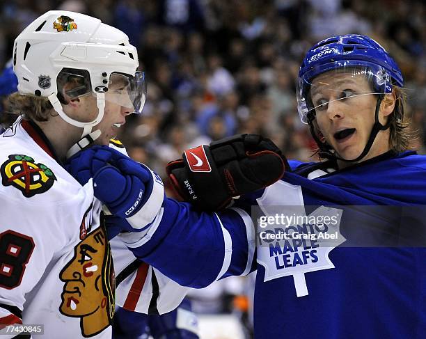 Simon Gamache of the Toronto Maple Leafs talks things over with Patrick Kane of the Chicago Blackhawks October 20, 2007 at the Air Canada Centre in...