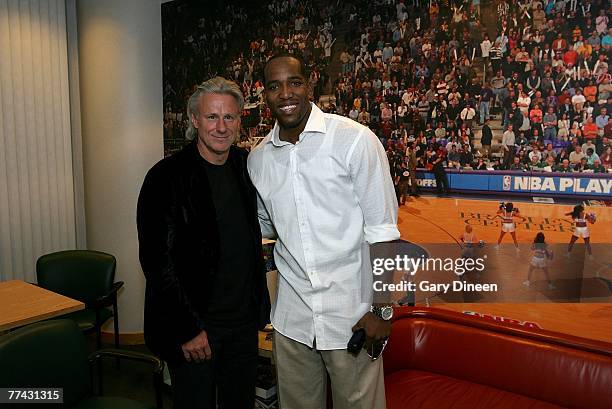 Michael Redd of the Milwaukee Bucks poses for a photograph with tennis legend Bjorn Borg following the game against the Minnesota Timberwolves at the...