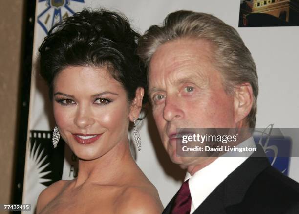 Actors Catherine Zeta-Jones and husband Michael Douglas arrive for the third annual 'A Fine Romance', an evening of celebrity performances honoring...