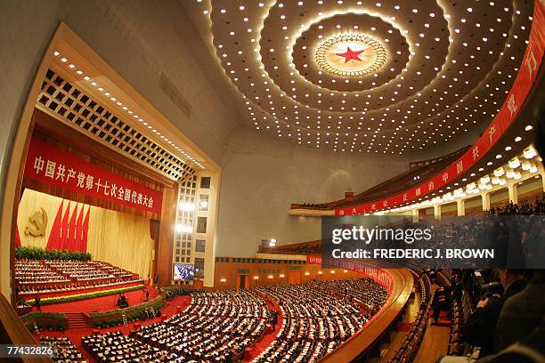 Chinese Communists wrap up their 17th five-yearly Party Congress inside the Great Hall of the People in Beijing, 21 October 2007, beneath the red...