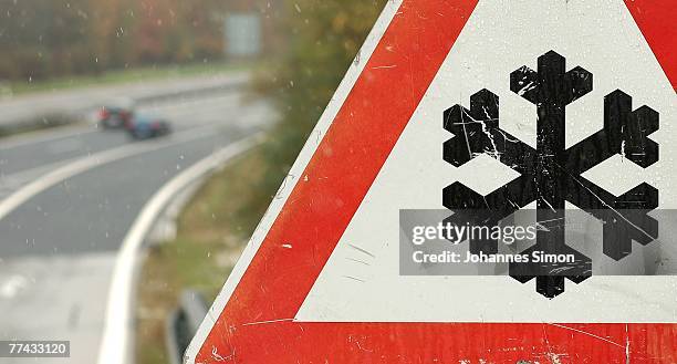 Sign beside A96 motorway warns car drivers to be careful due to bad weather conditions after first snowfall on October 21, 2007 near Schoeffelding,...