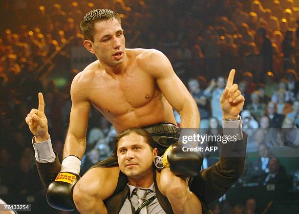 German boxer Felix Sturm celebrates after his WBA middleweight world champion fight against Randy Griffin of the US 20 October 2007 in Halle, western...