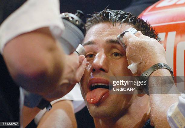 German boxer Felix Sturm grimaces as he is treated during his WBA middleweight world champion fight against Randy Griffin of the US 20 October 2007...