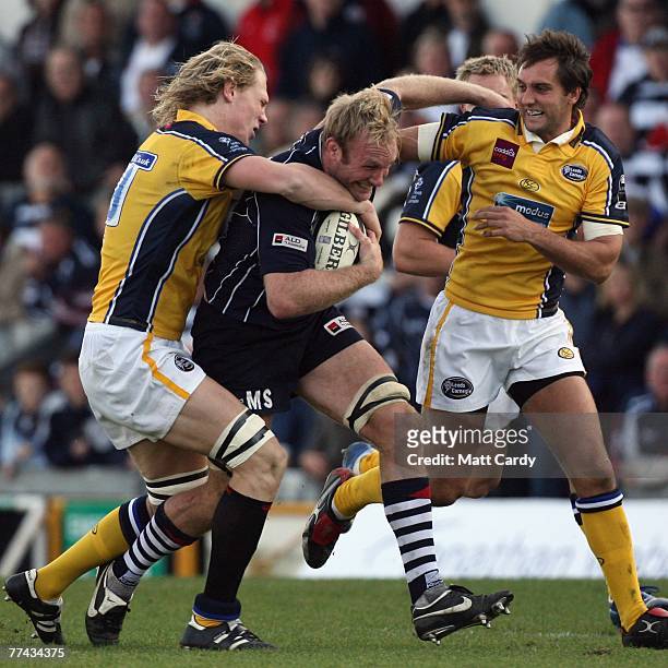Matt Salter of Bristol is double tackled during the Guinness Premiership match between Bristol and Leeds Carnegie at the Memorial Stadium on October...
