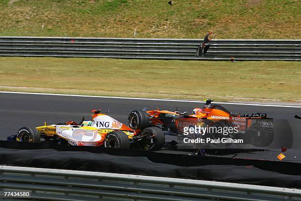 Sakon Yamamoto of Japan and Spyker F1 runs into the back of Giancarlo Fisichella of Italy and Renault at the start of the Brazilian Formula One Grand...