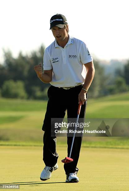 Steve Webster of England celebrates as he sinks a birdie putt on the 13th green during the final round of the Portugal Masters at Oceanico Victoria...