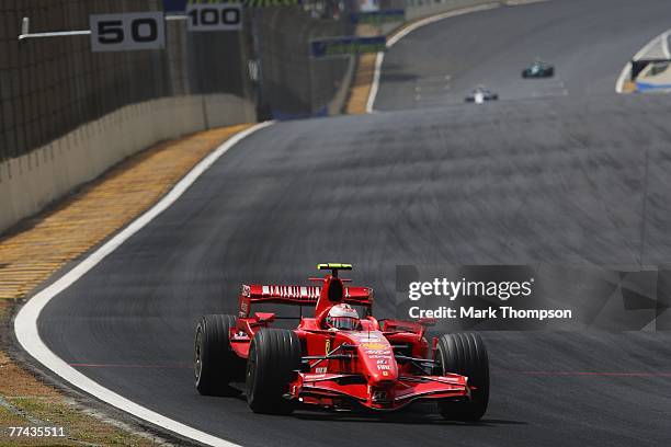 Kimi Raikkonen of Finland and Ferrari drives on his way to winning the race and the F1 World Championship at the Brazilian Formula One Grand Prix at...