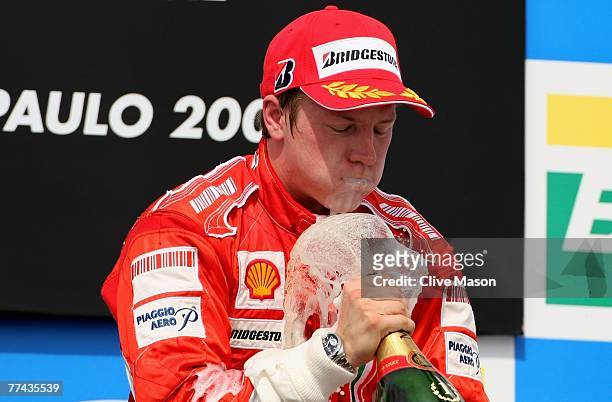 Kimi Raikkonen of Finland and Ferrari celebrates on the podium after winning the race and the F1 World Championship at the Brazilian Formula One...