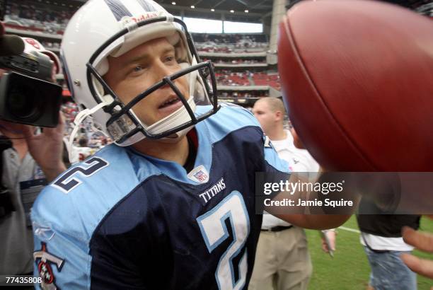 Kicker Rob Bironas of the Tennessee Titans jogs off the field after kicking the game-winning field goal to break the NFL record with 8 field goals in...