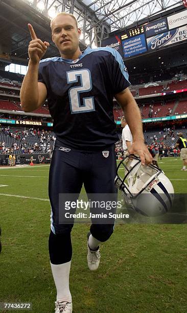 Kicker Rob Bironas of the Tennessee Titans jogs off the field after kicking the game-winning field goal and breaking the NFL record with eight field...
