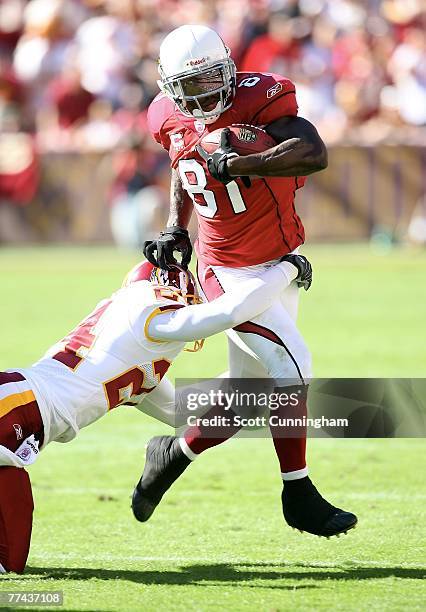 Anquan Boldin of the Arizona Cardinals runs against Shawn Springs of the Washington Redskins at FedEx Field October 21, 2007 in Landover, Maryland....