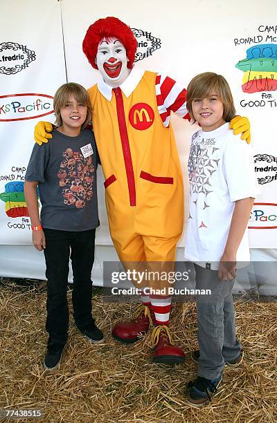 Actors Cole Sprouse and Dylan Sprouse pose with clown Ronald McDonald at the Camp Ronald McDonald 15th Annual Family Halloween Carnival on October...