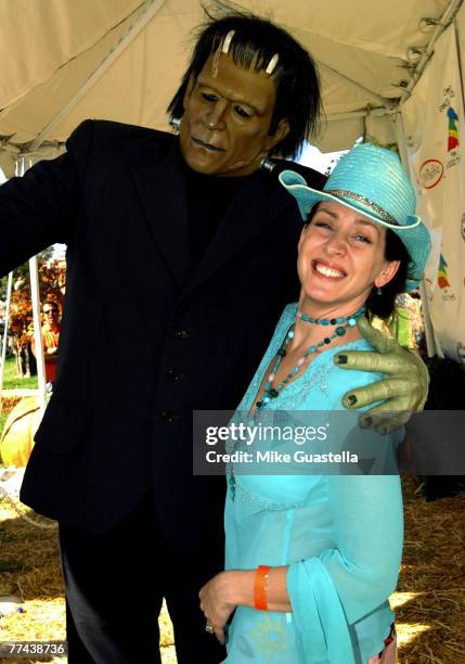 Actress Joely Fisher posing with Frankenstein attending Camp Ronald McDonald For Good Times 15th Annual Family Halloween Carnival at Wadsworth...