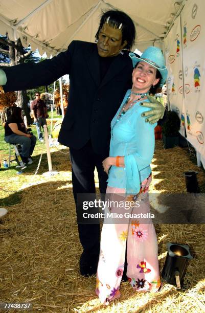 Actress Joely Fisher posing with Frankenstein attending Camp Ronald McDonald For Good Times 15th Annual Family Halloween Carnival at Wadsworth...