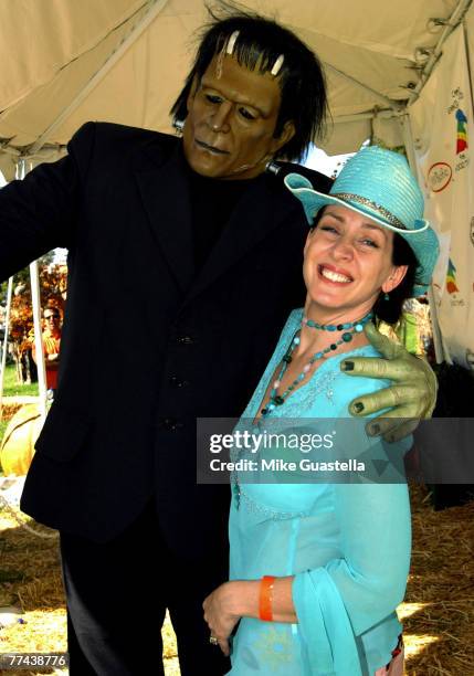 Actress Joely Fisher posing with Frankenstein attending Camp Ronald McDonald For Good Times 15th Annual Family Halloween Carnival at Wadsworth...