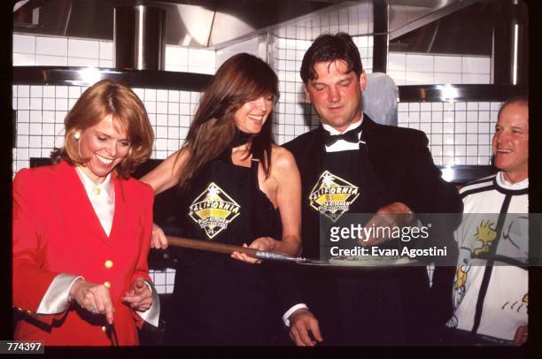 New York Lieutenant Governor Betsy McCaughey, model Carol Alt, and hockey player Ron Greschner stand in the kitchen at the grand opening of...