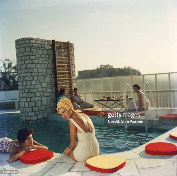 Premium Rates Apply. Young women by the Canellopoulos penthouse pool, Athens, July 1961.