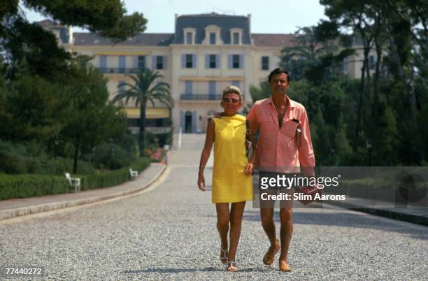French actor Louis Jourdan and his wife Quiquie at the Eden Roc annex of the Hotel Du Cap D'Antibes on the French Riviera, August 1969.
