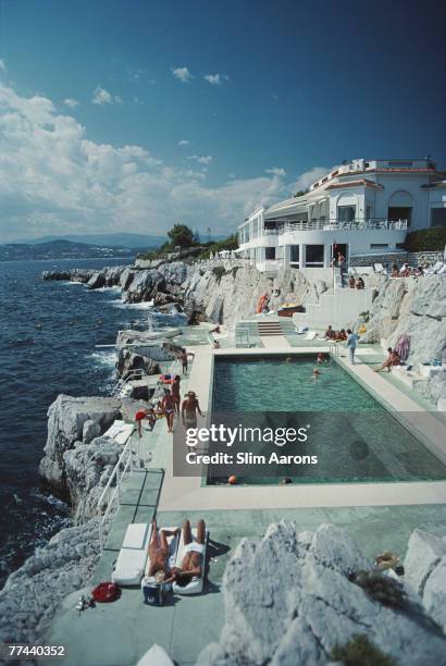 Guests by the pool at the Hotel du Cap Eden-Roc, Antibes, France, August 1976.