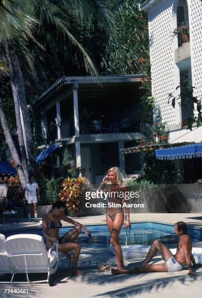 Guests by the pool at the home of Mrs Melchor Perusquia Sr, Acapulco, Mexico, 1978.