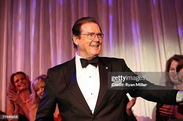 Honoree Sir Roger Moore surounded by Bond girls during the Thalians 52nd Anniversary Gala honoring Sir Roger Moore to raise funds for the Thalians...