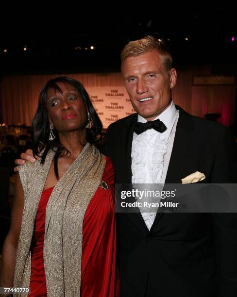 Bond girl actress Trina Parks with actor Dolph Lundgren arrive at the Thalians 52nd Anniversary Gala honoring Sir Roger Moore to raise funds for the...