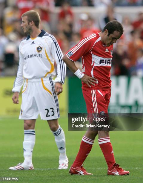 Los Angeles Galaxy's David Beckham and Chicago Fire's Cuauhtemoc Blanco stand on the field during the second half of an MLS game at Toyota Park on...