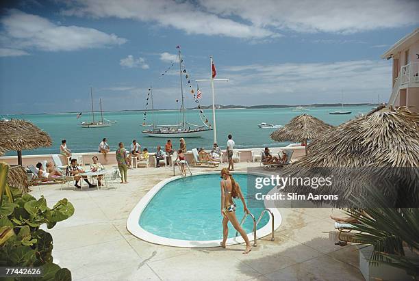 People by the pool at Club Peace And Plenty, Georgetown on the island of Great Exuma, Bahamas, April 1967.