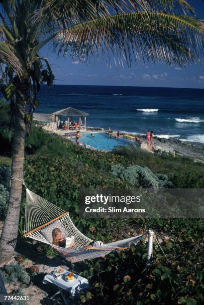 College student Jan Woods relaxes in a hammock at the Abaco Inn on Elbow Cay, one of the Abaco Islands in the Bahamas, March 1986.