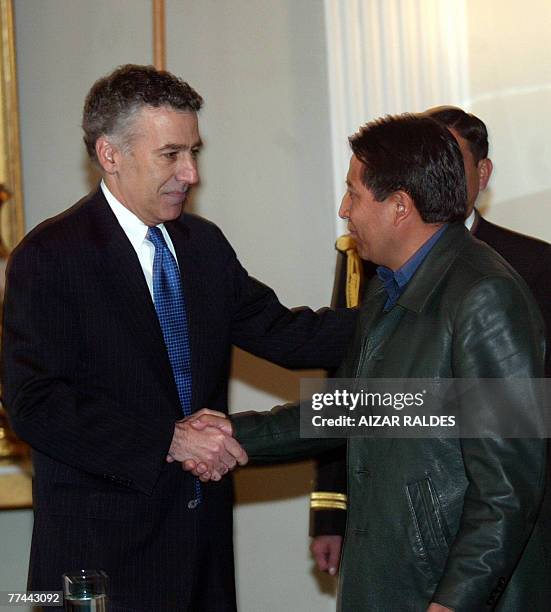 Bolivia's Foreign minister David Choquehuanca and US ambassador to Bolivia Philip Goldberg, shake hands during a press conference in La Paz, on...