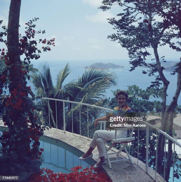 Woman by a swimming pool in Acapulco, Mexico, circa 1954.