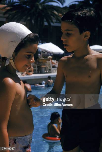 Christina Onassis and her brother Alexander at the Monte Carlo Beach Club, Monaco, 1958.
