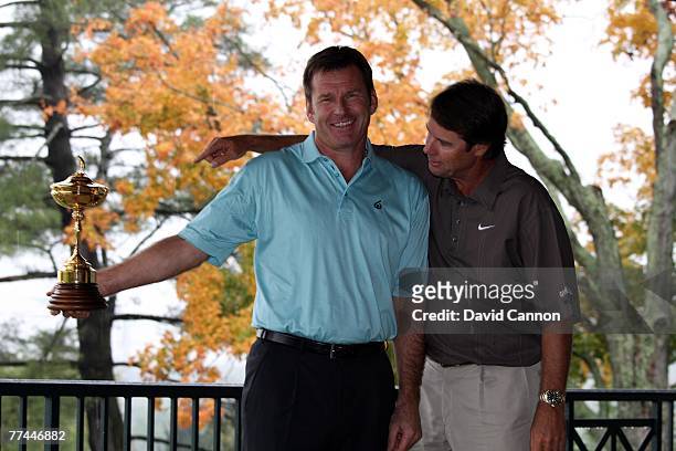 Nick Faldo the European Captain tries to keep the trophy from Paul Azinger the USA captain during the photoshoot as a preview for the 2008 Ryder Cup...