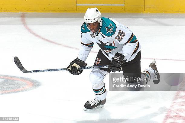 Mike Grier of the San Jose Sharks chases down the puck during a game against the Edmonton Oilers on October 4, 2007 at Rexall Place in Edmonton,...
