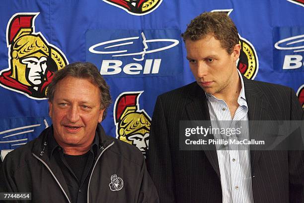 Eugene Melnyk and Dany Heatley of the Ottawa Senators meet with the press for a photo opportunity regarding Dany Heatley's contract extension just...