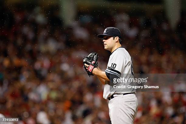 Joba Chamberlain of the New York Yankees readies himself to pitch as gnats swarm around them against the Cleveland Indians during Game Two of the...