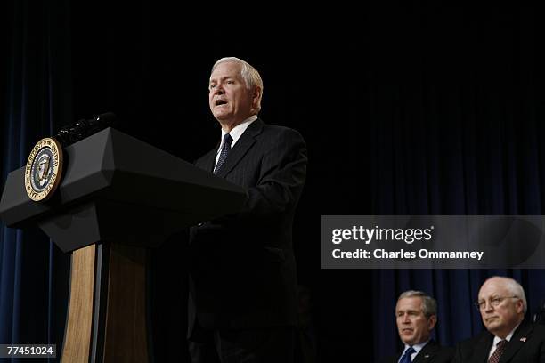 Robert Gates, speaks after being sworn in as the new US Defense Secretary by US Vice President Dick Cheney as US President George W. Bush looks on at...