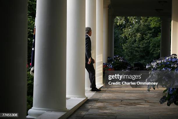 President George W. Bush returns to the oval office after making a statement on the death of Iraq 's terrorist leader Abu Musab Al-Zarqawi June 8,...