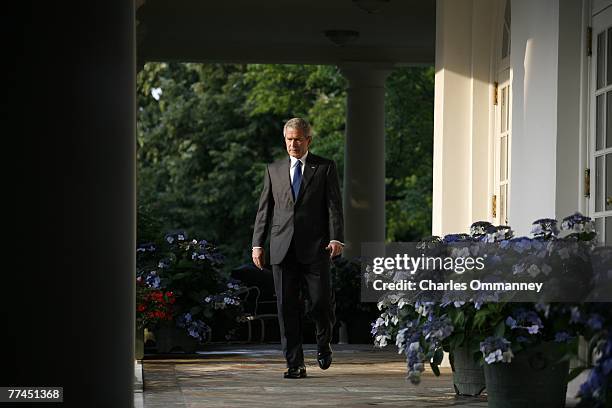 President George W. Bush walks out of the oval office to make a statement on the death of Iraq 's terrorist leader Abu Musab Al-Zarqawi June 8, 2006...