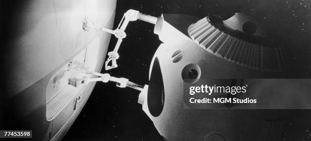 Small EVA pod is used to carry out repair work on the Discovery One in a scene from the classic science fiction movie '2001: A Space Odyssey',...